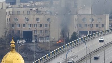 Smoke and flame rise near a military building after an apparent Russian strike in Kyiv, Ukraine.