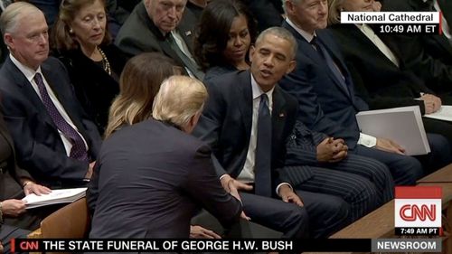 Former President Barack Obama greets President Donald Trump.