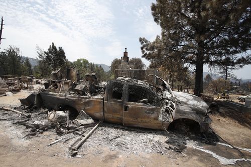 One of many burned-out wrecks on the moonscape. Picture: AP