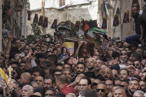 Mourners carry the casket of slain Al Jazeera veteran journalist Shireen Abu Akleh during her funeral in Jerusalem's Old City , Friday, May 13, 2022. Abu Akleh, a Palestinian-American reporter who covered the Mideast conflict for more than 25 years, was shot dead Wednesday during an Israeli military raid in the West Bank town of Jenin. (AP Photo/Mahmoud Illean)