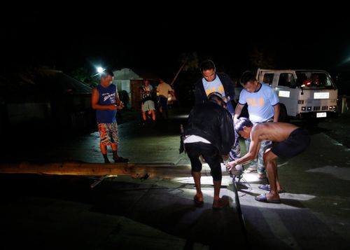 Associated Press journalists in a hotel in Cagayan's capital city of Tuguegarao saw tin roof sheets and other debris hurtle through the air and store signs crash to the ground. Cars shook as gusts pummelled a parking lot.