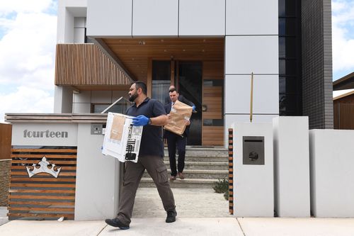 Police remove evidence from the home of former Auburn deputy mayor Salim Mehajer today. (AAP)