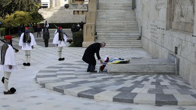 Prince Charles lays a wreath at the tomb of the Unknown Soldier in Athens, Thursday, March 25, 2021.