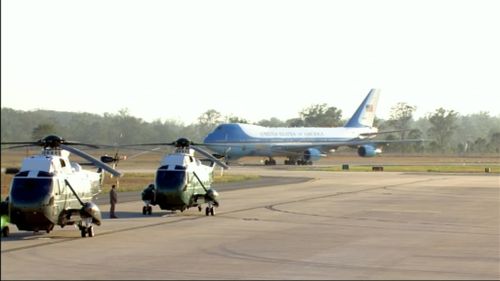 US President Barack Obama touches down at Amberley air base, with US helicopters pictured in the foreground. (9NEWS)