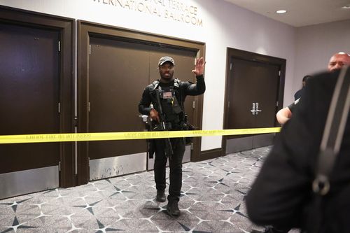 Law enforcement responds to an incident at the White House Correspondents Dinner, Saturday, April 25, 2026, in Washington. (AP Photo/Tom Brenner)