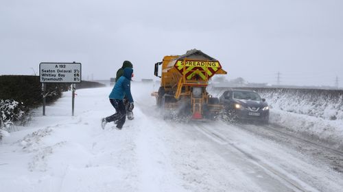 People throw snowballs at vehicles travelling on the A192 near Seaton Delaval. (AAP)