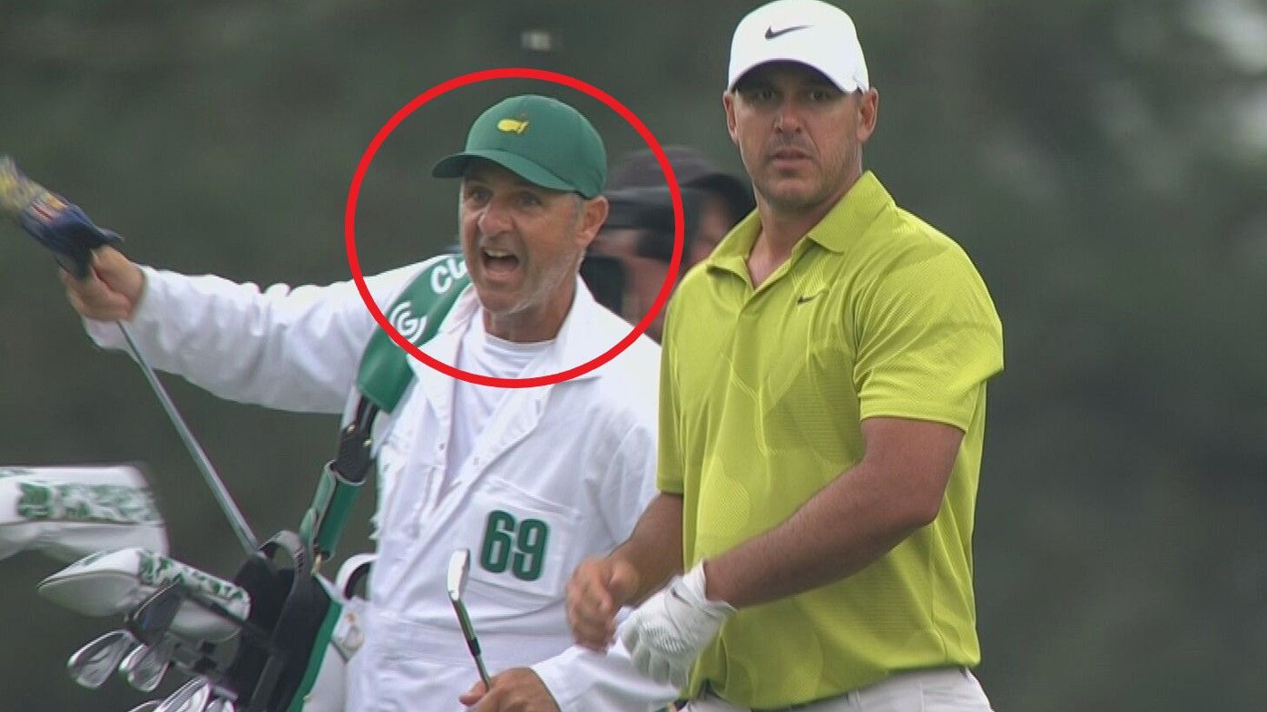 Brooks Koepka&#x27;s caddie, Ricky Elliott, appears to offer advice to playing partner Gary Woodland.