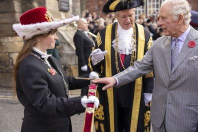 King Charles III touches a sword, symbolising his being formally welcomed into the city, during a ceremony at Micklegate Bar, where the Sovereign is traditionally welcomed to the city, in York, England, Wednesday Nov. 9, 2022 