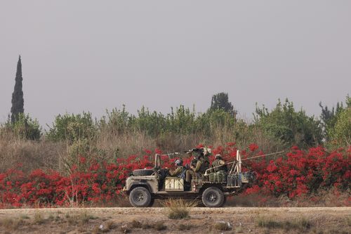 Israeli troops move near the border with Gaza on October 28, 2023 in Sderot, Israel. 