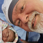 Kyle Sandilands in a 'love bubble' after welcoming son Otto