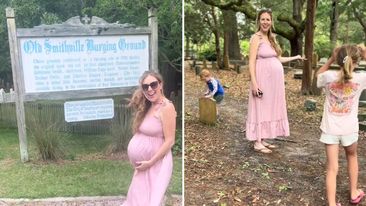 Pregnant woman looking for baby name inspiration at a cemetery