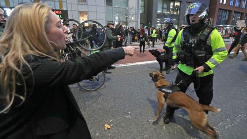 People square off against police officers during a "Kill the Bill" march in Bristol.