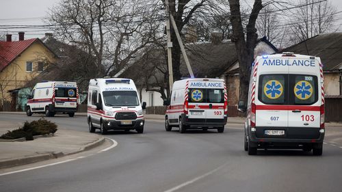 Ambulances are seen traveling to and from the Yavoriv military facility on March 13, 2022 in Novoiavorivsk, Ukraine.(Photo by Dan Kitwood/Getty Images)