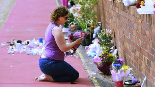 Mourners pay tribute to the four victims in the Dreamworld disaster. 