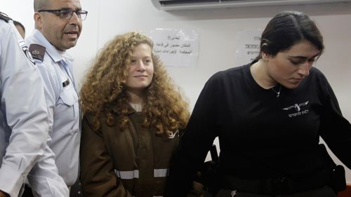 In this file image  Ahed Tamimi is brought to a courtroom inside the Ofer military prison near Jerusalem. (AP)