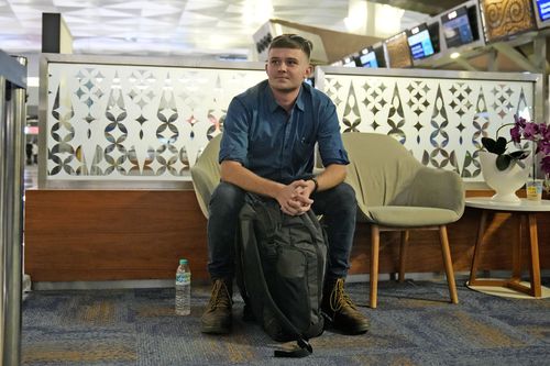 Australian national Bodhi Mani Risby-Jones from Queensland waits waits for check in at Soekarno-Hatta International Airport in Tangerang, Indonesia, Saturday, June 10, 2023.  