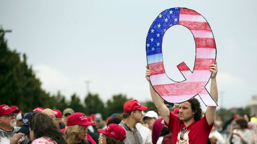 Founder of hacktivist group Anonymous is trying to take down far-right cult QAnon