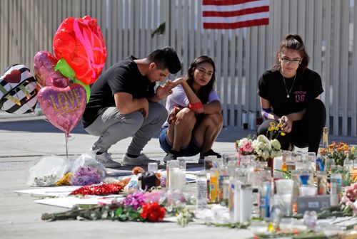 Mourners lay tributes to those that lost their lives while watching the Route 91 Music Festival.
