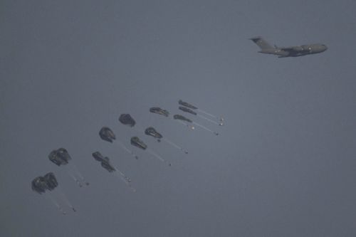 A plane drops humanitarian aid over the northern Gaza Strip as seen from southern Israel, Thursday, March 28, 2024. 