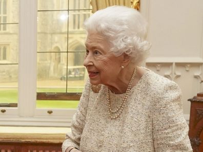 WINDSOR, ENGLAND - MARCH 16: Queen Elizabeth II presents the Queen's Gold Medal for Poetry to Grace Nichols during a private audience at Windsor Castle on March 16, 2022 in Windsor, England. (Photo by Steve Parsons - WPA Pool/Getty Images)