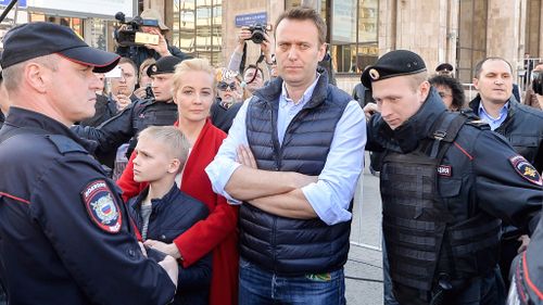 Navalny held as thousands protest Putin