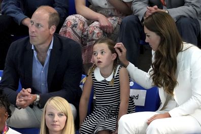 Prince William, Princess Charlotte and Kate, Duchess of Cambridge are seated to watch the swimming events, at Sandwell Aquatics Center on day five of the 2022 Commonwealth Games in Birmingham, England, Tuesday, Aug. 2, 2022.