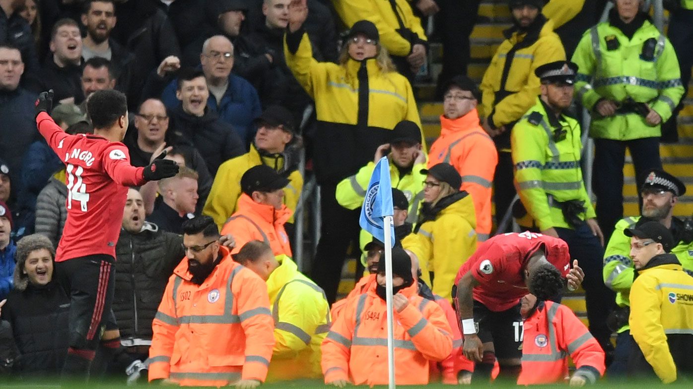 Arrest over Manchester derby racism claim, after United star Fred hit by object