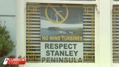 Locals in Tasmania's top tourist town fight wind turbine project.