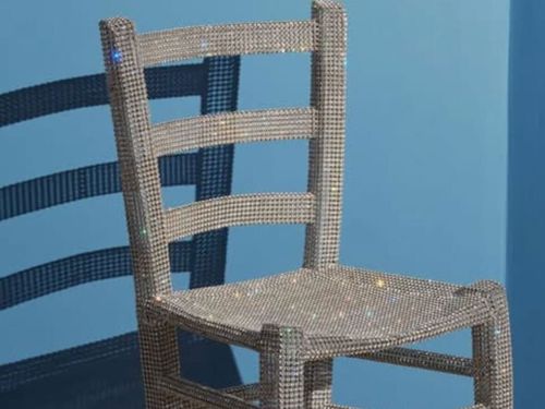 The chair covered in Swarovski crystals, made by artist Nicola Bolla, was in Verona, Italy's Palazzo Maffei Museum. 