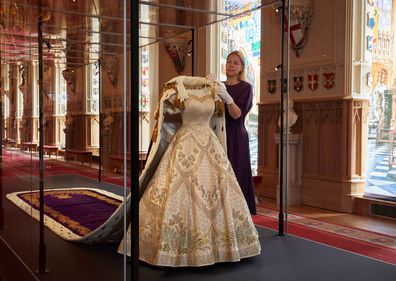 The Coronation Dress and Robe of Estate go on display inside St George's Hall in Windsor Castle