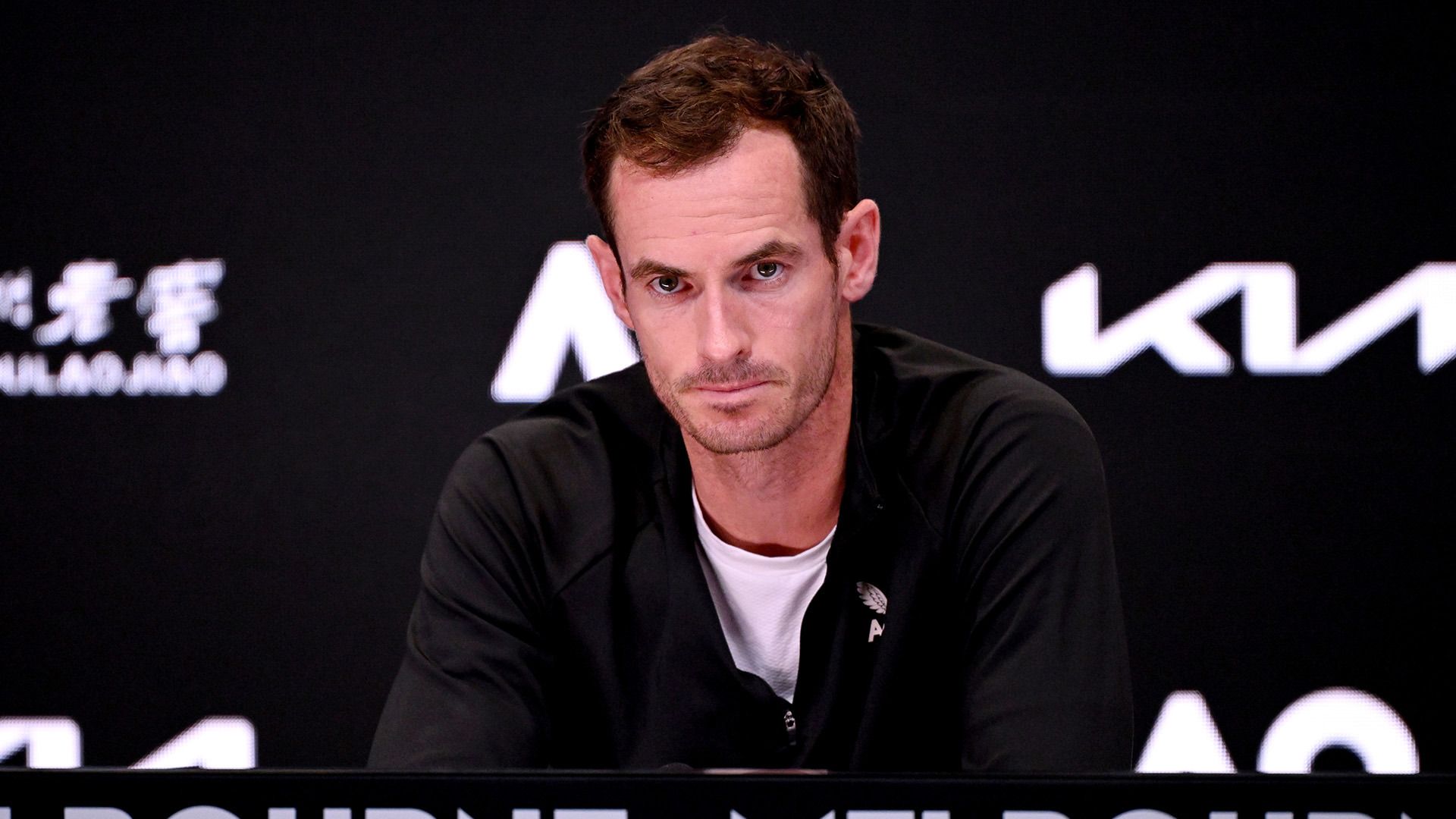 Andy Murray of Great Britain speaks to the media after his first round loss against Tomas Martin Etcheverry of Argentina during the 2024 Australian Open.