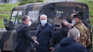 Anti-mafia Prosecutor Nicola Gratteri, left, stands by military personnel outside a specially constructed bunker on the occasion of the first hearing of a maxi-trial against more than 300 defendants of the &#x27;ndrangheta crime syndicate