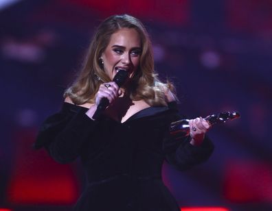 Adele on stage to accept the award for Album of the Year at the Brit Awards 2022 in London Tuesday, Feb. 8, 2022. (Photo by Joel C Ryan/Invision/AP)