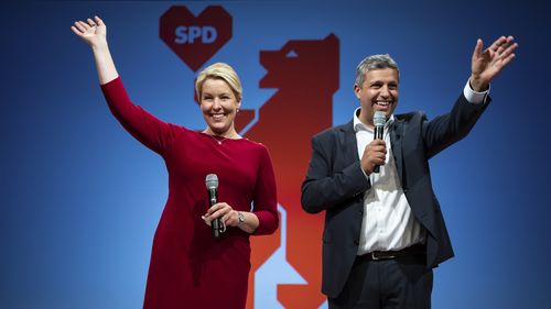 Franziska Giffey, left, top candidate of the Berlin SPD for the office of Governing Mayor, and Raed Saleh, co-party leader of the Berlin SPD take the stage at the election party of the Berlin SPD in Kreuzberg, Berlin on Sunday. 