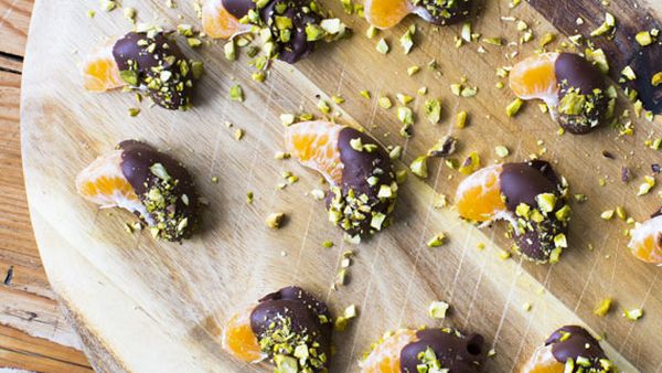 Pistachio and dark chocolate dipped mandarin