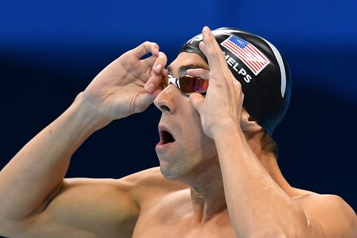 Michael Phelps is excited for young Clark Kent Apuada to continue breaking his swimming records. Picture: APP