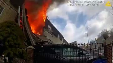 Body cam footage from a New York PD officer captured the home as it was engulfed in flames.
