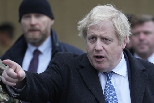 British Prime Minister Boris Johnson talk to British troops stationed in Poland on a NATO mission of enhancement of the alliance's eastern flank in Wesola, near Warsaw Poland, on Feb. 10, 2022.