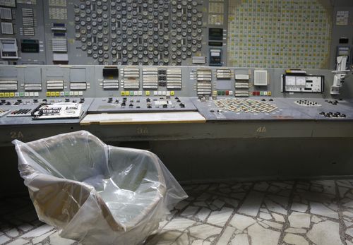 An operator's arm-chair covered with plastic sits in an empty control room of the 3rd reactor at the Chernobyl nuclear plant, in Chernobyl, Ukraine, on April 20, 2018