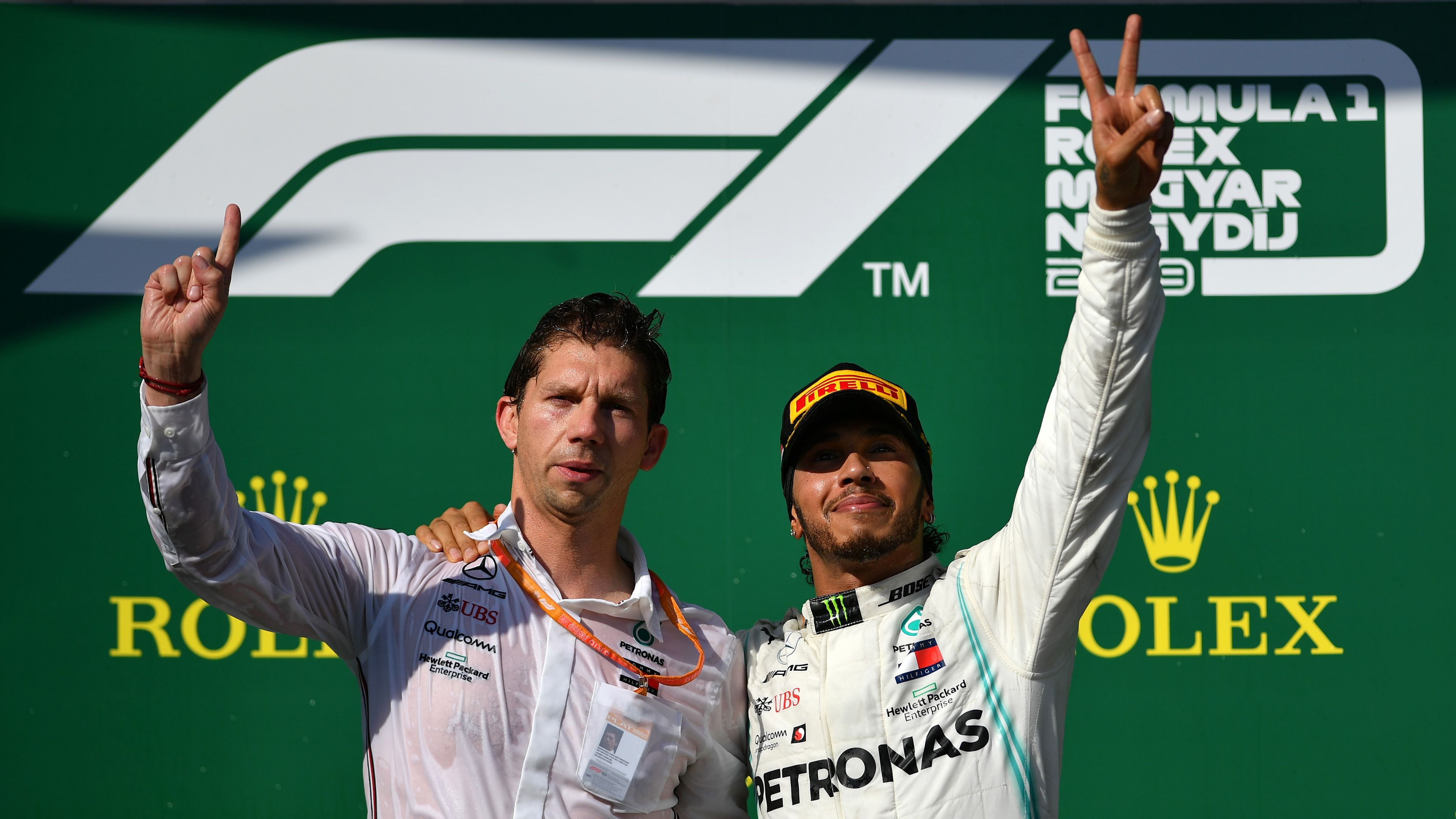 Hungarian Grand Prix race winner Lewis Hamilton on the podium with Mercedes chief strategist James Vowles.