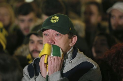 Many of the club's fans were in tears as they laid flowers and scarves as a tribute.