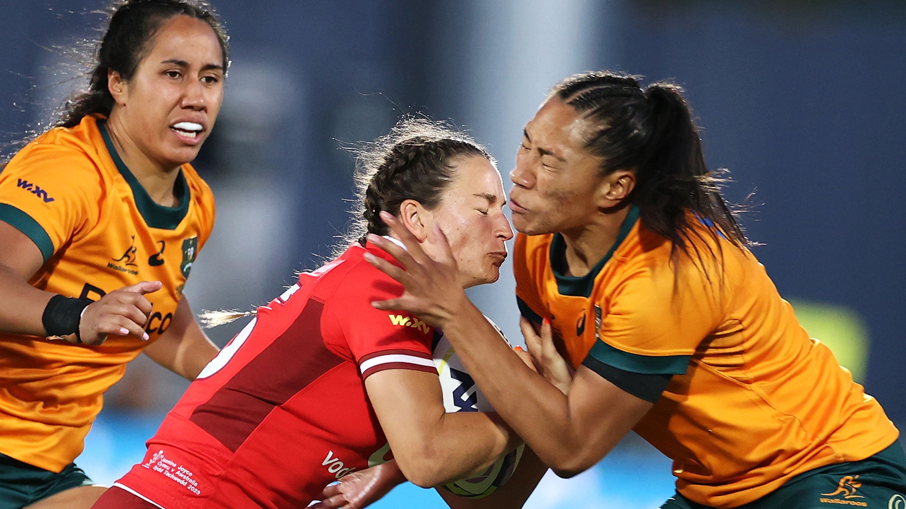 Jasmine Joyce of Wales is tackled by Siokapesi Palu of Australia.