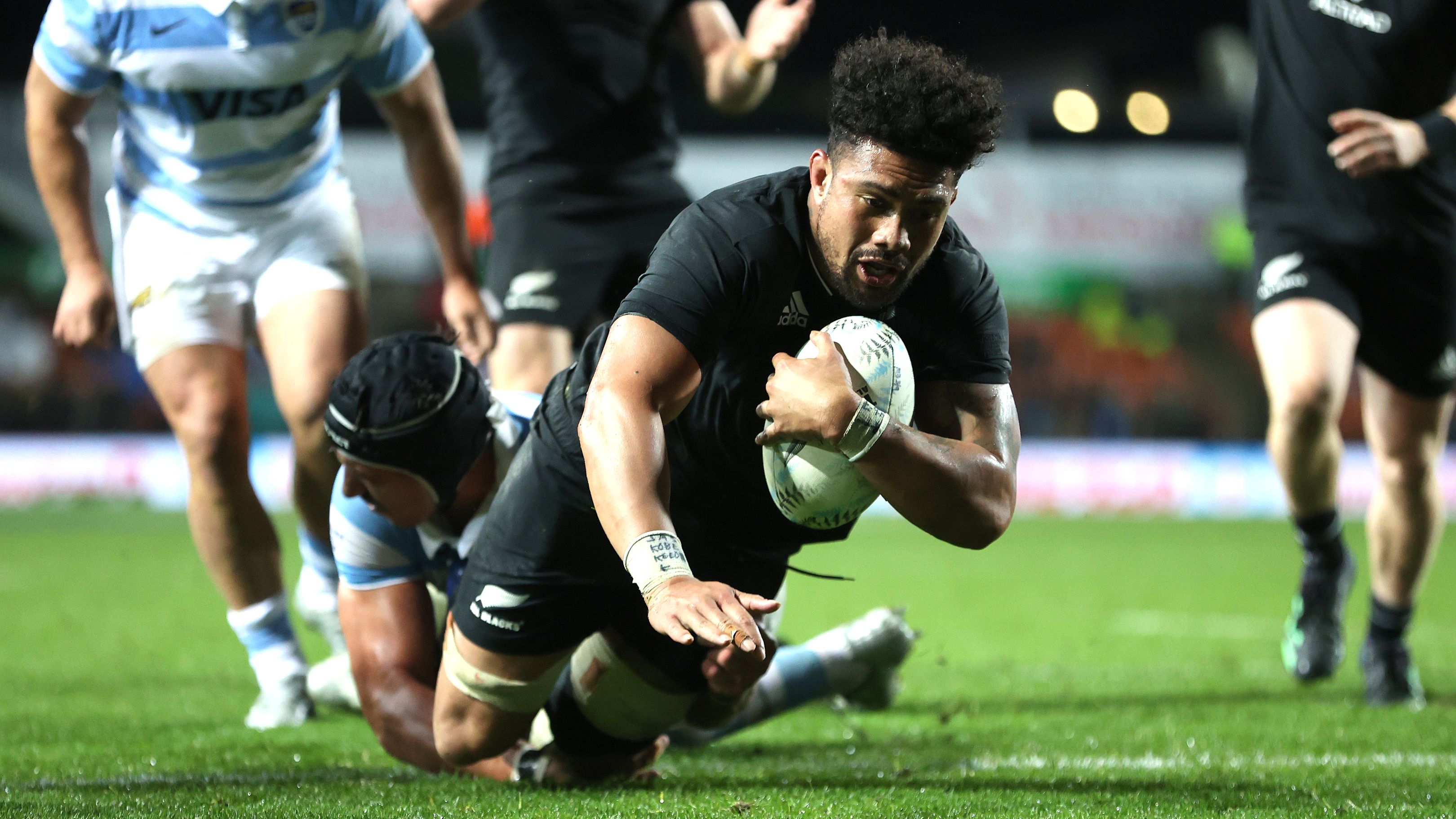 Ardie Savea of New Zealand scores a try.
