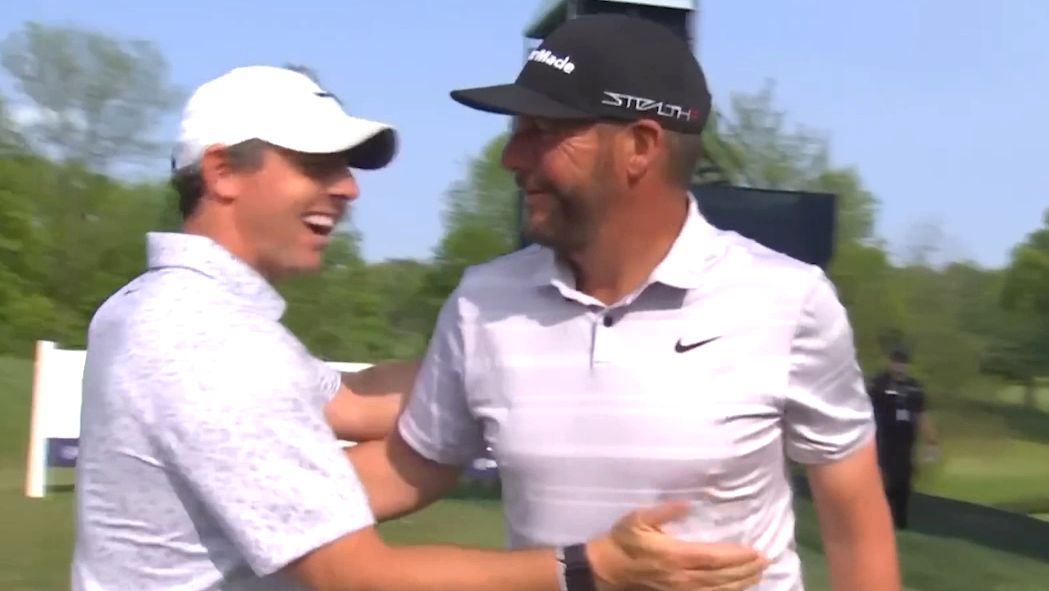 Rory McIlroy congratulates Michael Block on his PGA Championship hole in one.