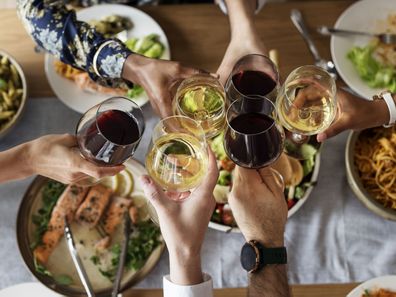 Friends eating and drinking together.