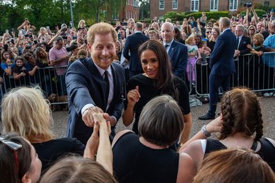 William and Meghan crowd flowers Queen 2022
