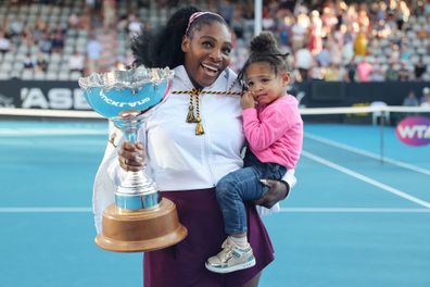Serena Williams with daughter Olympia and her trophy at the 2018 French Open