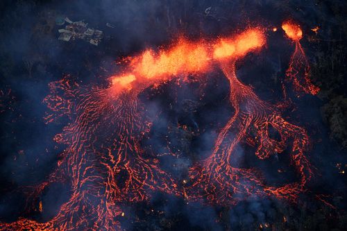 Activity continues on Kilauea's east rift zone, as a fissure eruption fountains more than 200 feet into the air, consuming all in its path. (AP)
