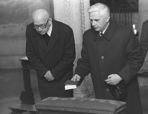 Newly nominated Archbishop of Munich and Freising, Joseph Ratzinger, right, prays with Bishop Erns Tewes in the Crypta of the Cathedral of Freising, southern Germany on March 31, 1977. 