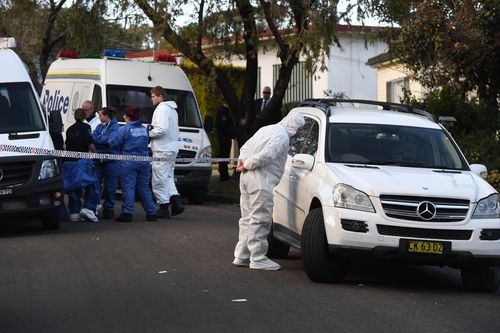 NSW Police and forensic services officers at the scene. (AAP)